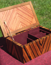 Custom inlaid box with Ebony body, Teak trim around lid, Boxwood Top Star Inlay consists of Cherry and Walnut